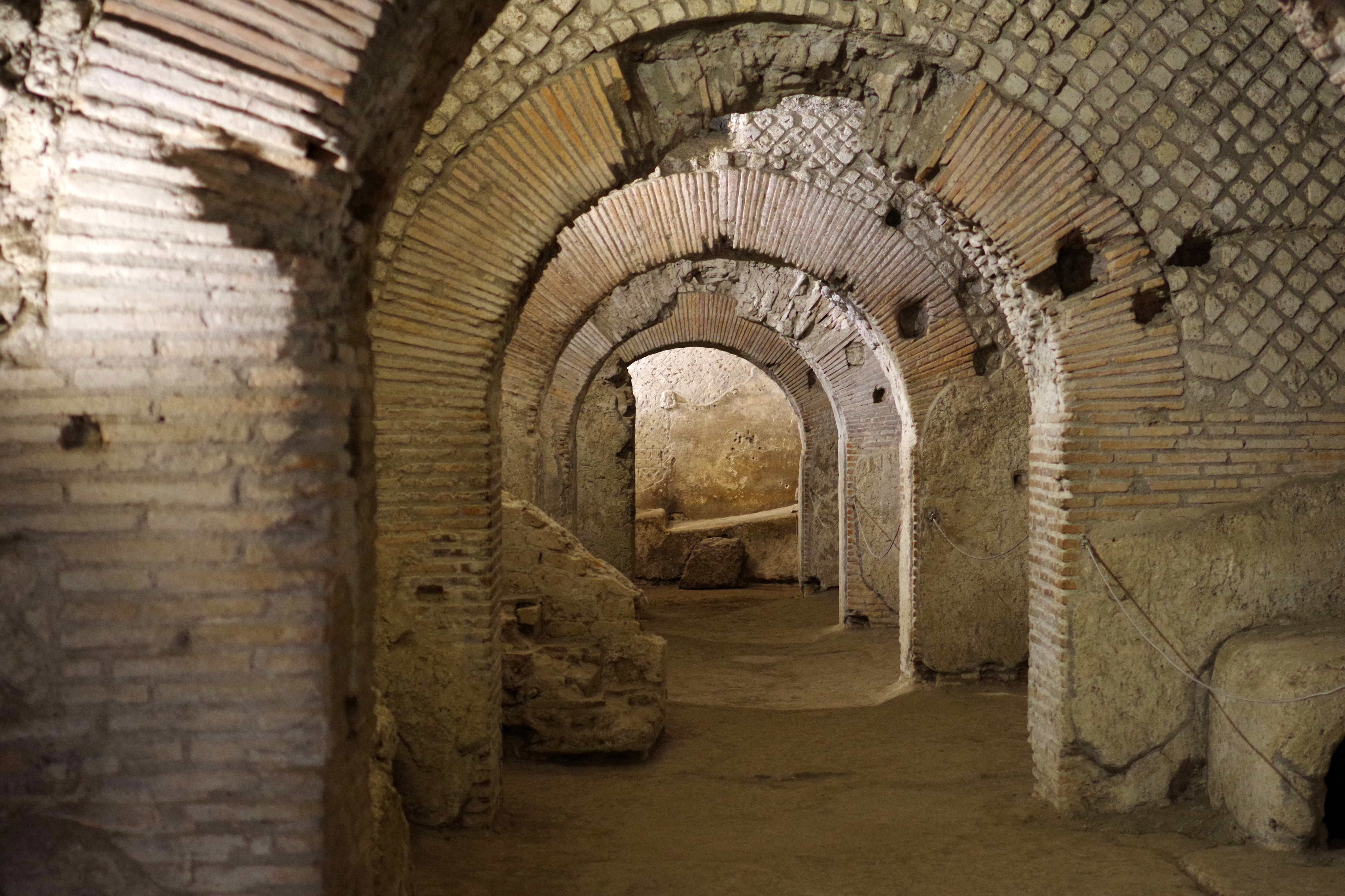Graeco-Roman Theater ruins in Naples Underground, showcasing ancient architecture.