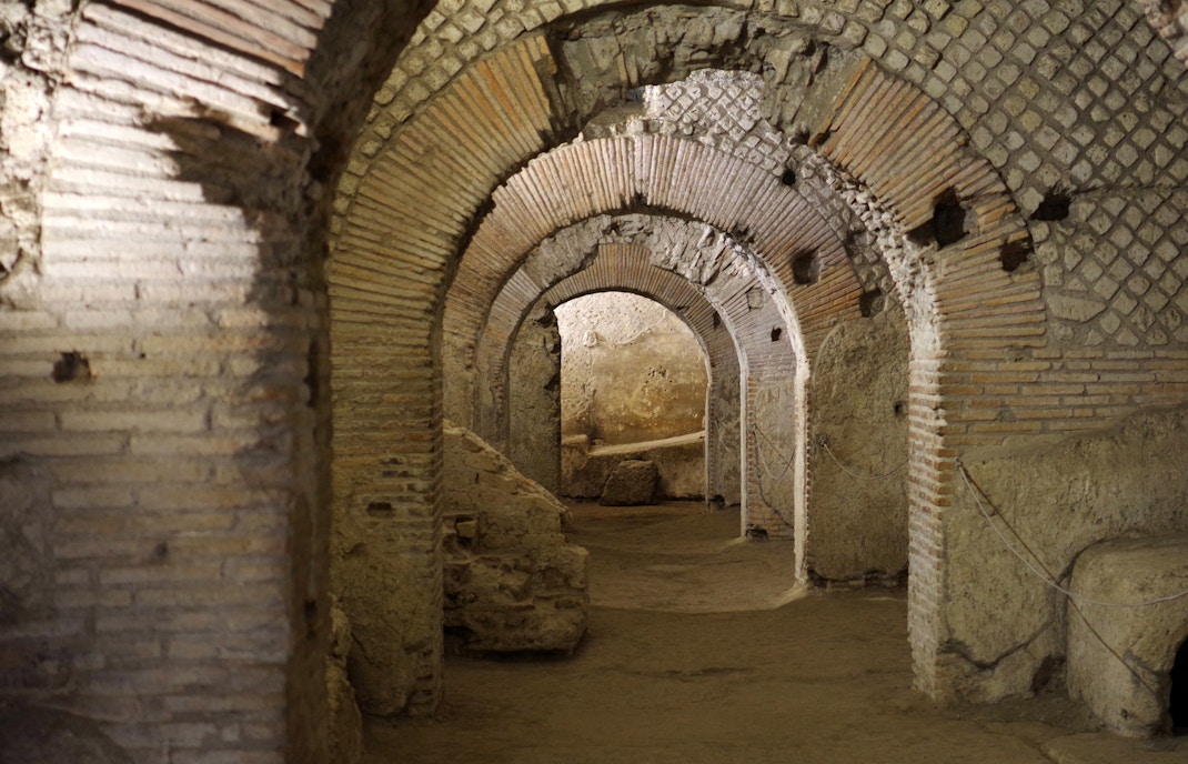 Graeco-Roman Theater ruins in Naples Underground, showcasing ancient architecture.
