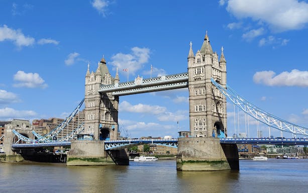 Tower Bridge view from a vintage boat during afternoon tea cruise in London.