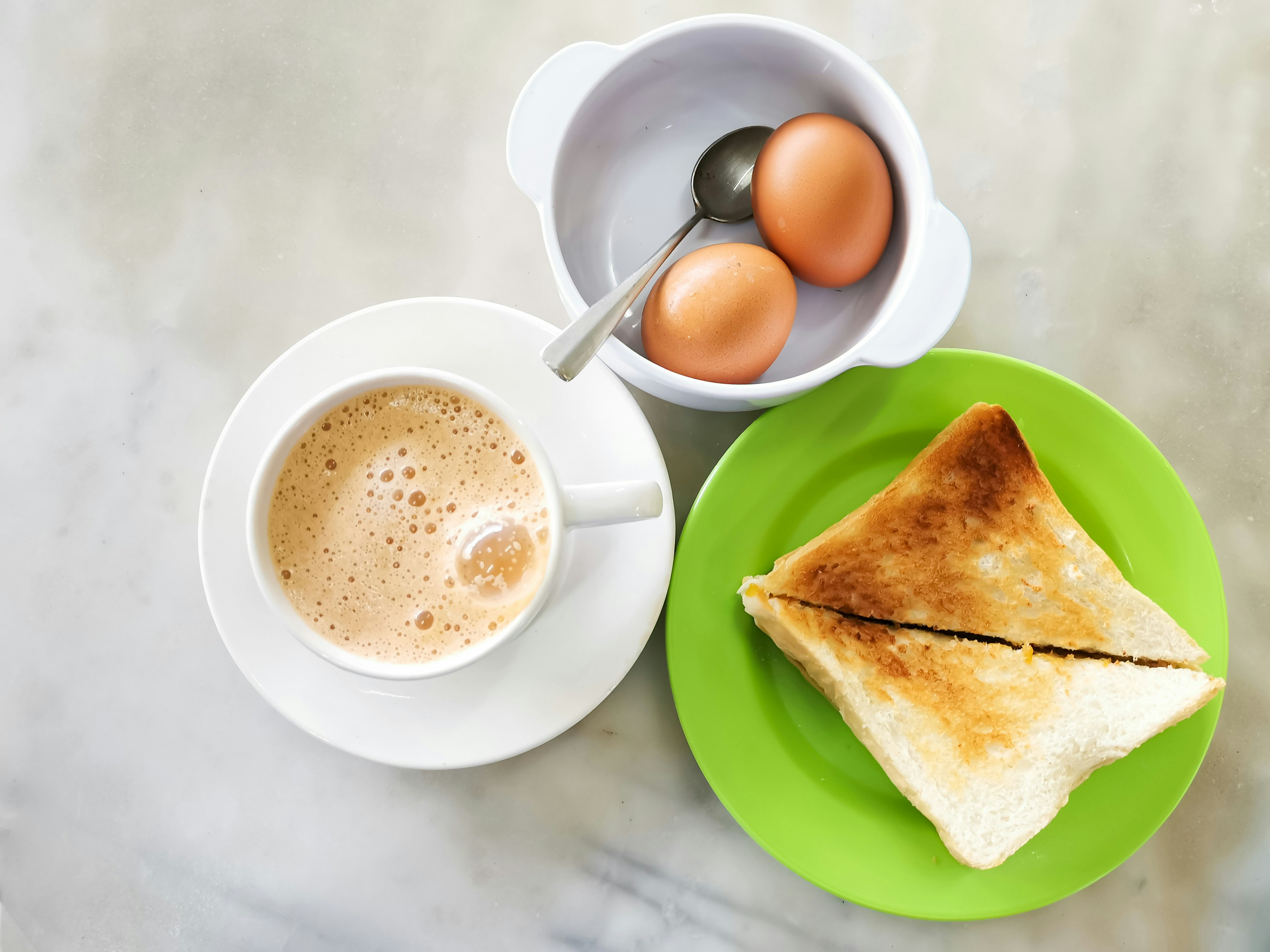 Kaya toast with butter and kaya spread, popular Singapore street food.