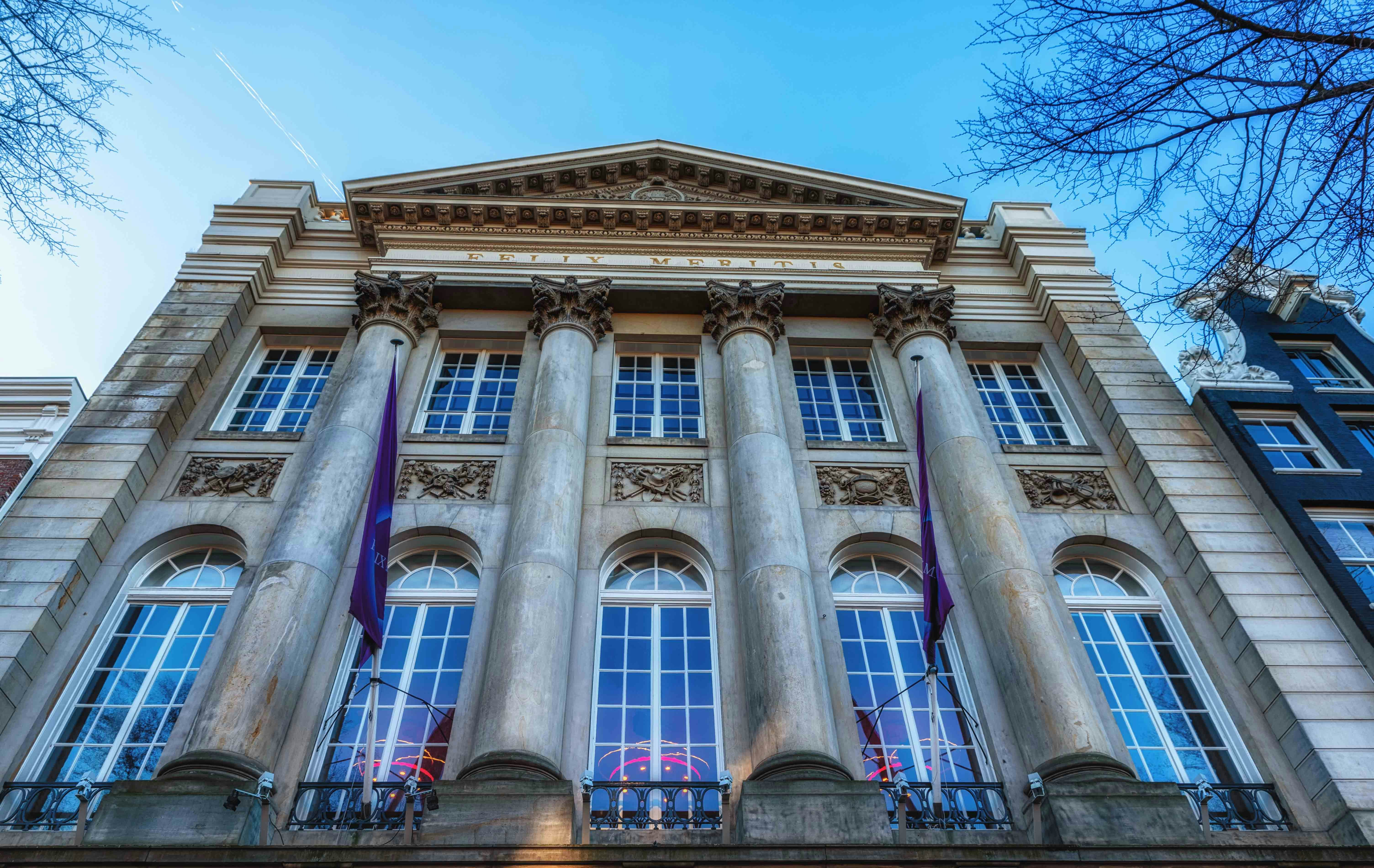 Hollandsche Schouwburg facade with columns in Amsterdam.