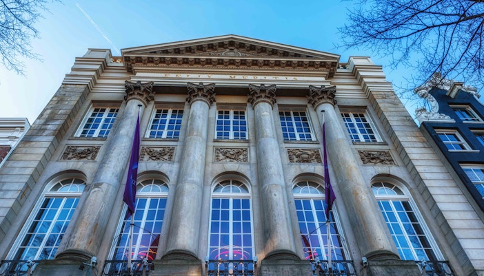 Hollandsche Schouwburg facade with columns in Amsterdam.