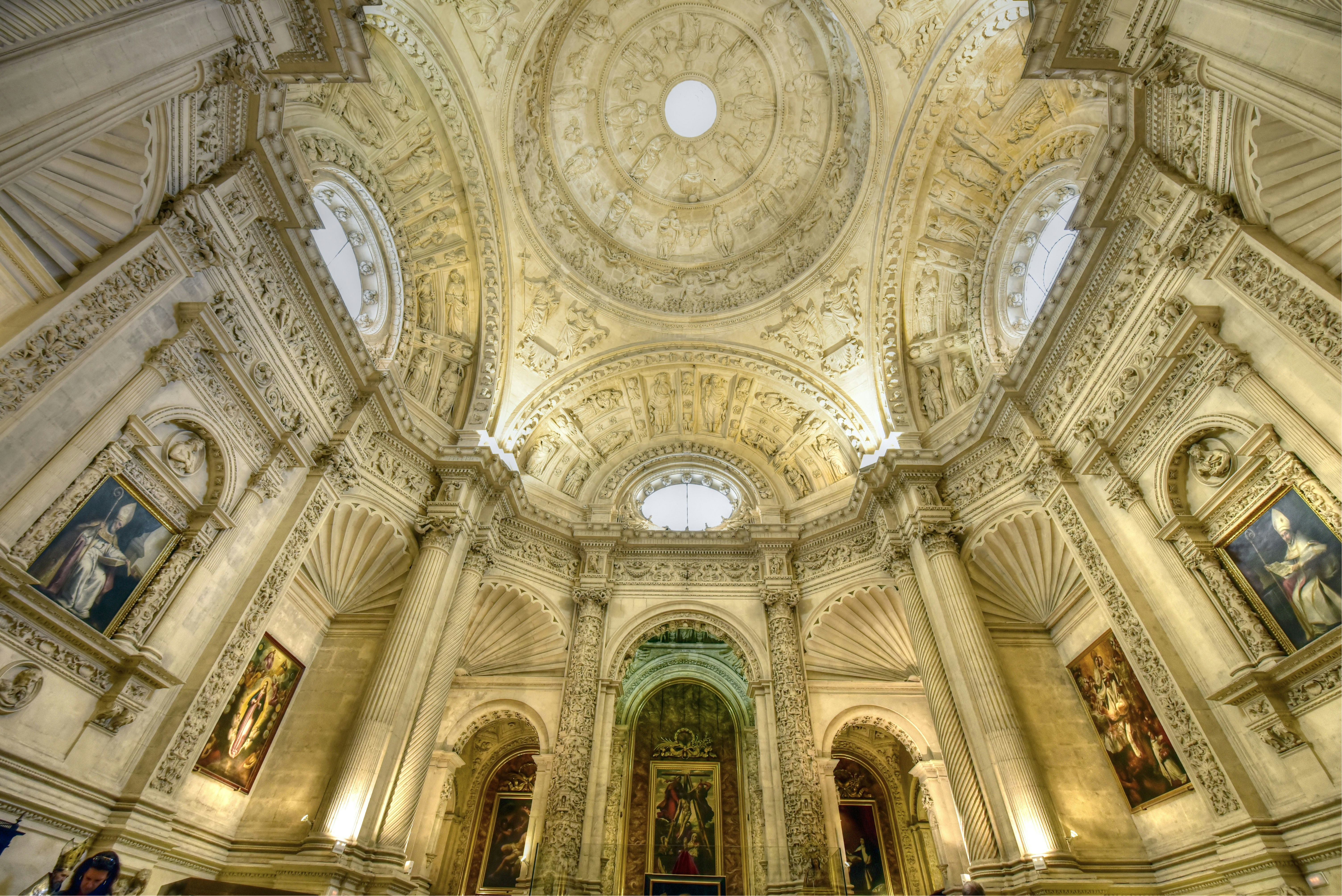 Main Sacristy interior, Seville Cathedral, showcasing ornate architecture and historical artifacts.