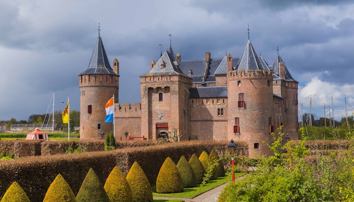 Amsterdam Castle Muiderslot with moat and gardens, accessible with Amsterdam City Card.