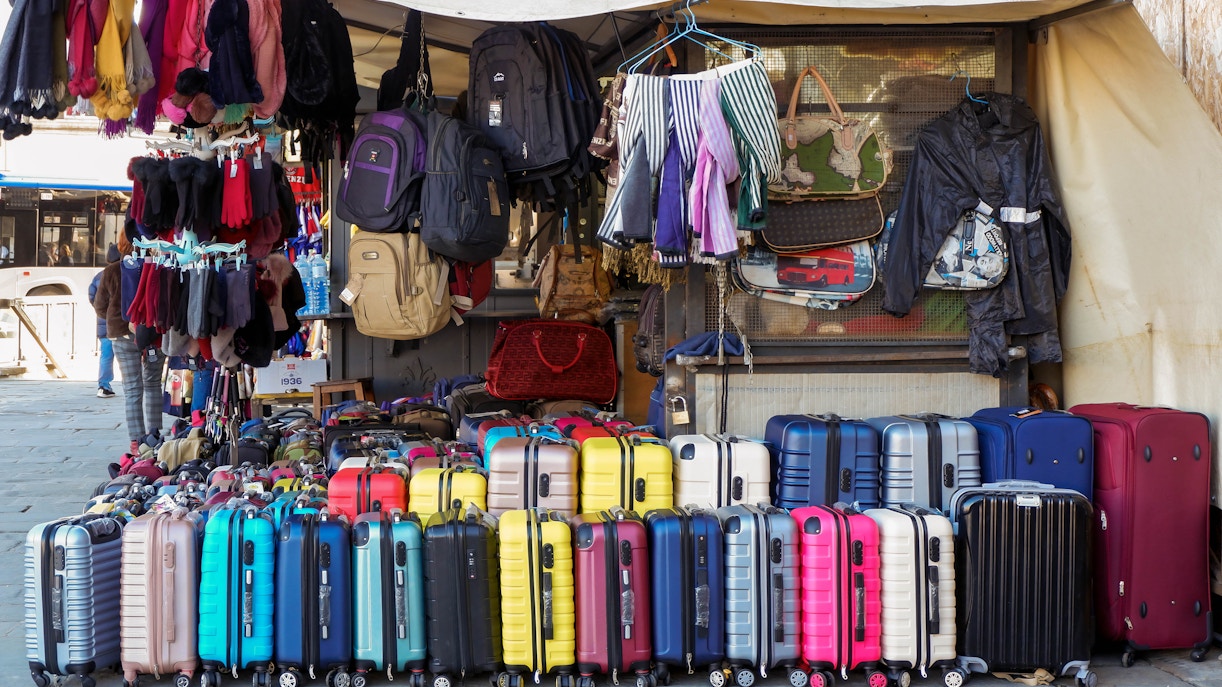 Il Mercato di Forte dei Marmi stalls with shoppers in Tuscany, Italy.