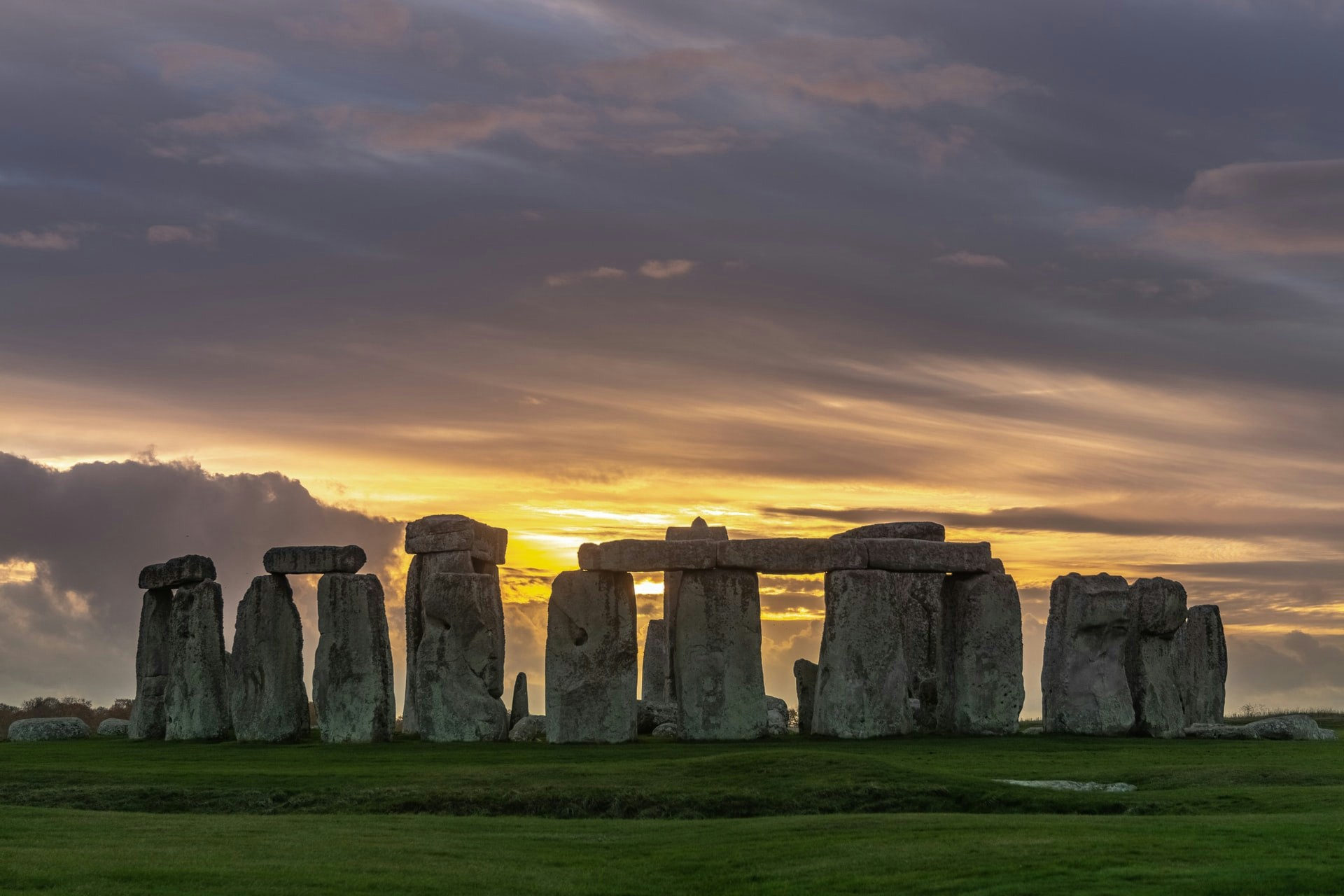 Stonehenge at sunset with dramatic sky, Wiltshire, England.