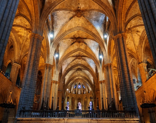Sagrada Familia Crypt interior with intricate stone carvings, Barcelona, Spain.