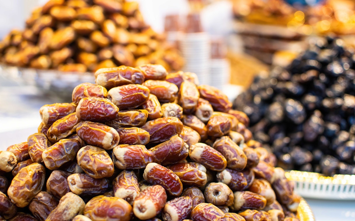 Dubai market display of assorted dates, popular souvenir.
