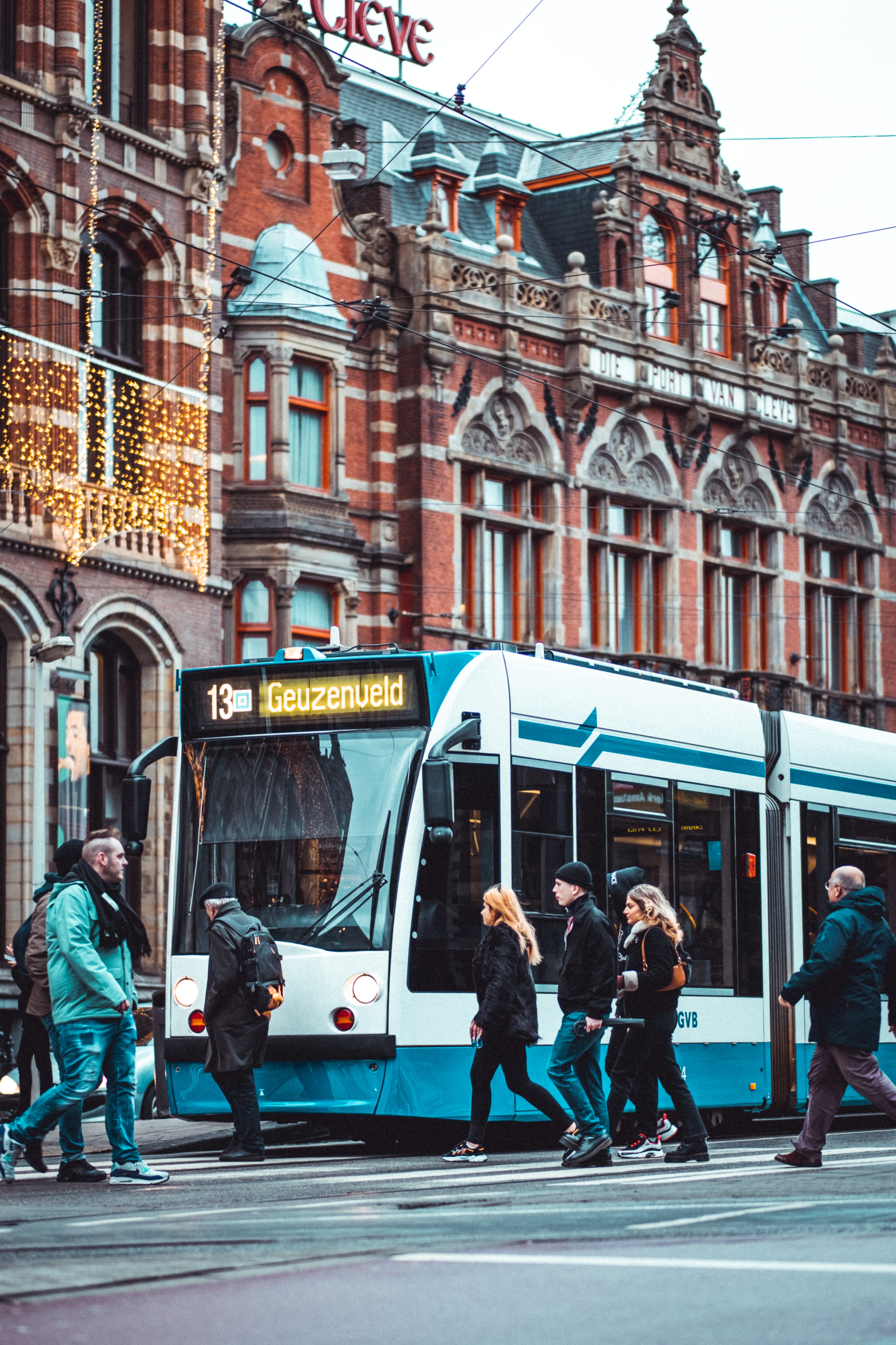 Amsterdam tram passing by Moco Museum entrance.