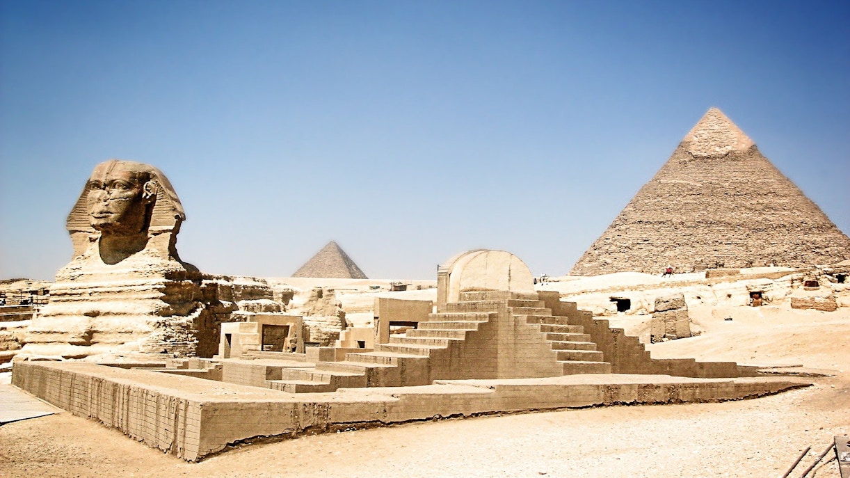 Sphinx and Pyramid of Giza under clear sky in Egypt.