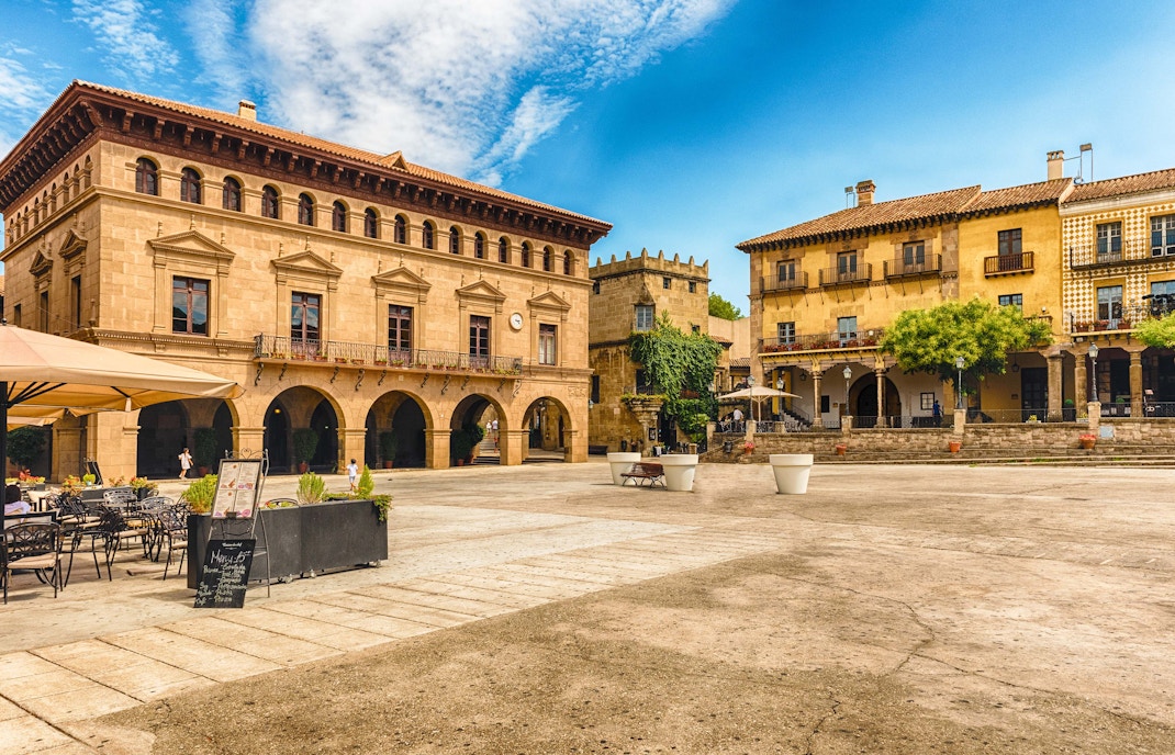 Poble Espanyol architecture view from Barcelona Hop-on Hop-off bus tour.