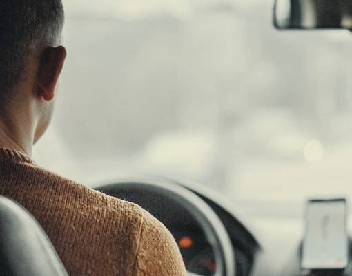 man driving a taxi