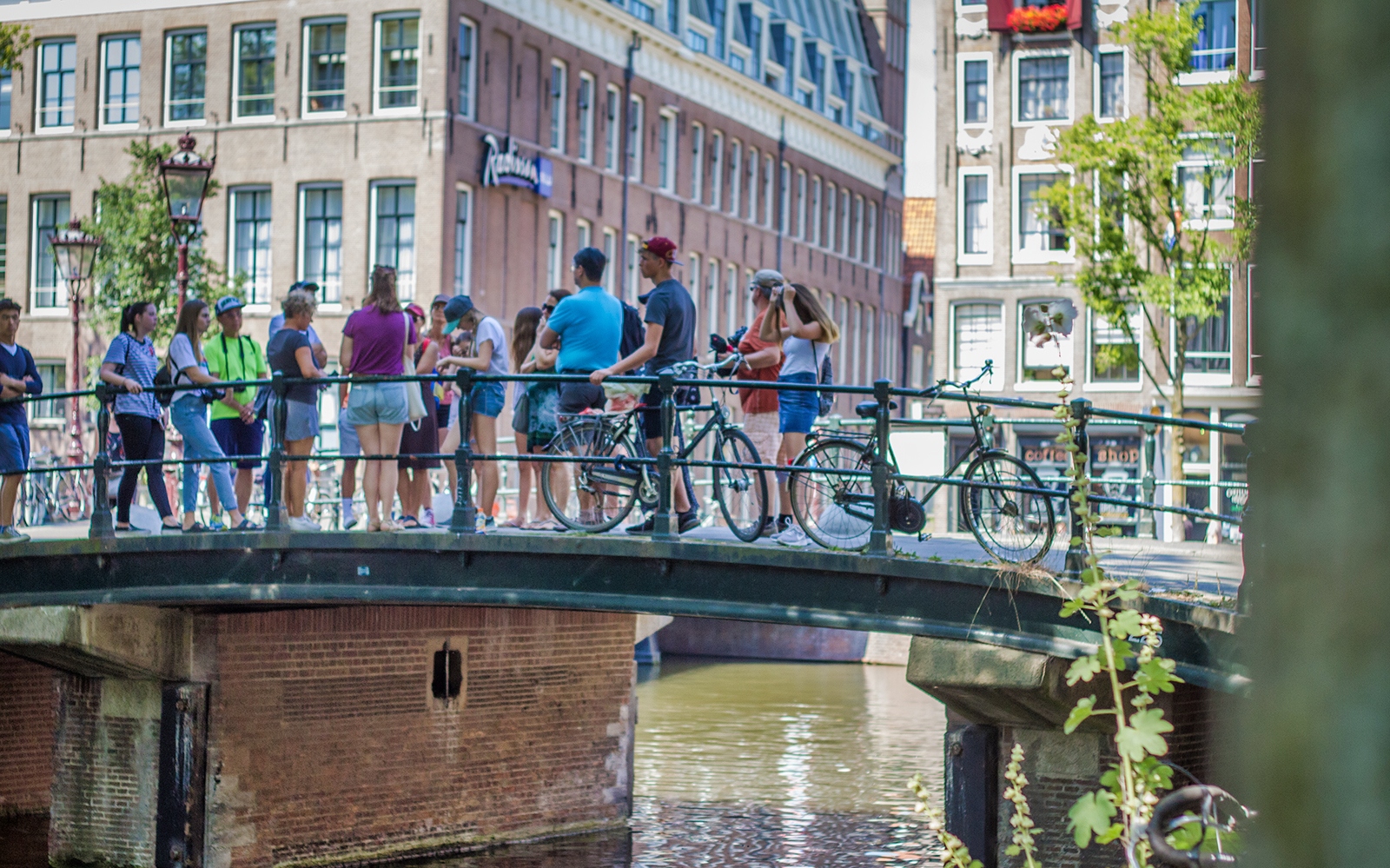 Anne Frank House exterior with visitors on Amsterdam walking tour.