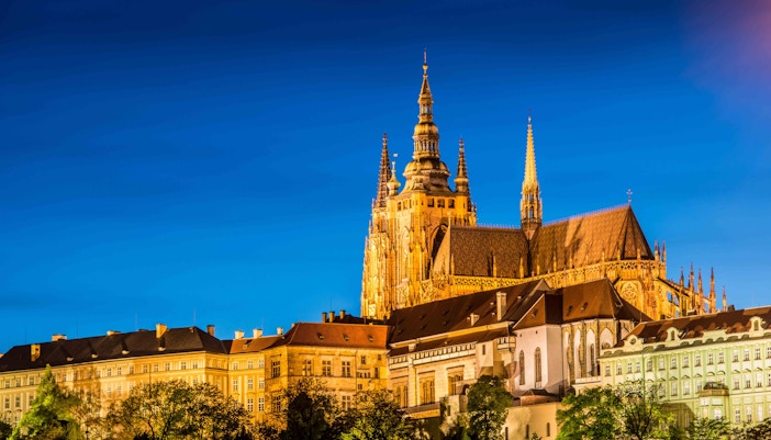 Tourists exploring the historic Prague Castle complex with skip-the-line access in Prague, Czech Republic.