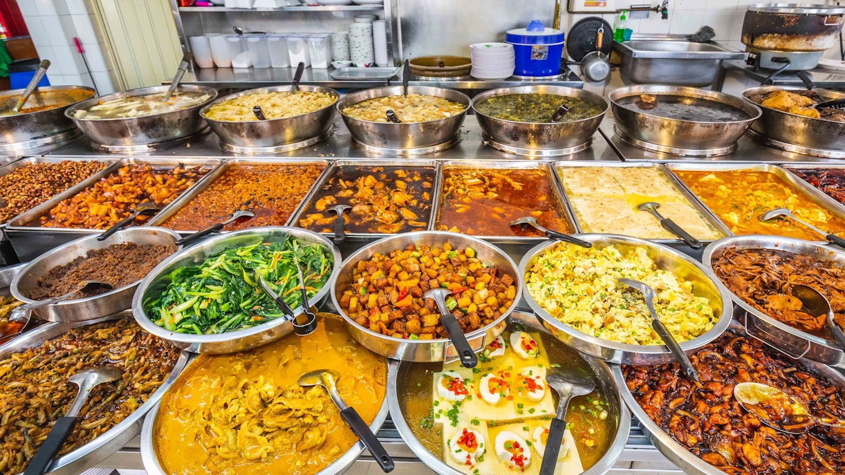 Newton Food Centre bustling with visitors enjoying Singapore street food.