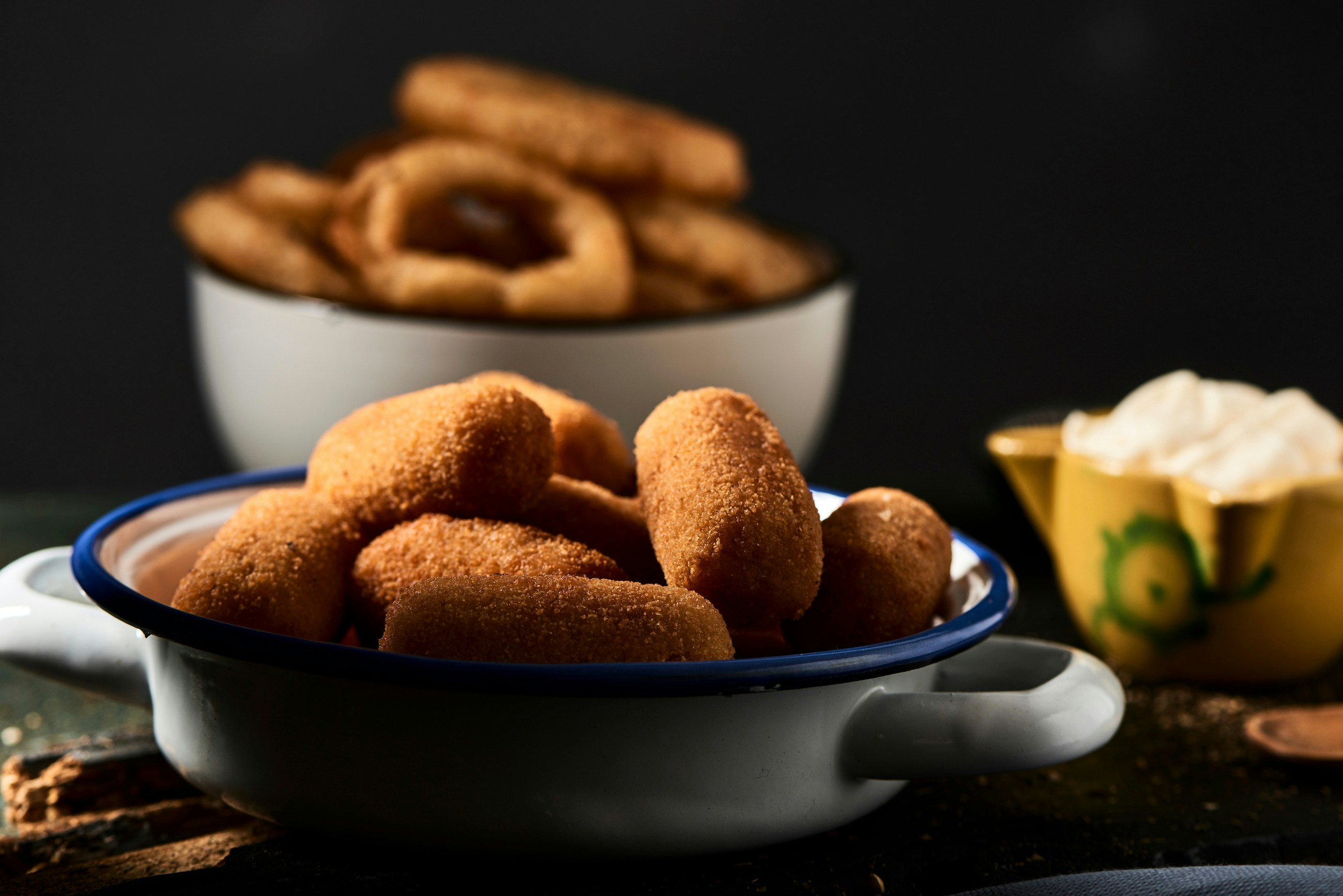 Traditional Spanish croquetas on a plate in a Madrid restaurant.