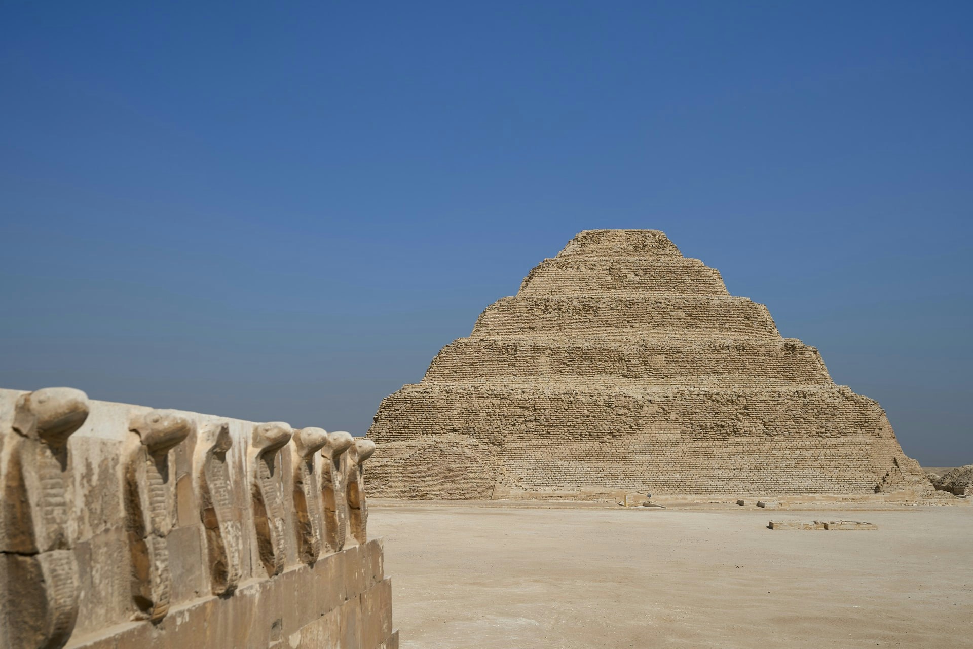 Saqqara Pyramid of Djoser in Egypt with surrounding desert landscape.