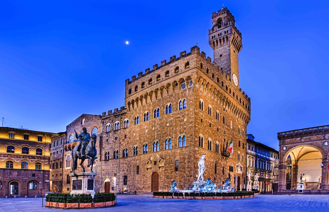 Palazzo Vecchio exterior in Florence during March with clear blue sky.