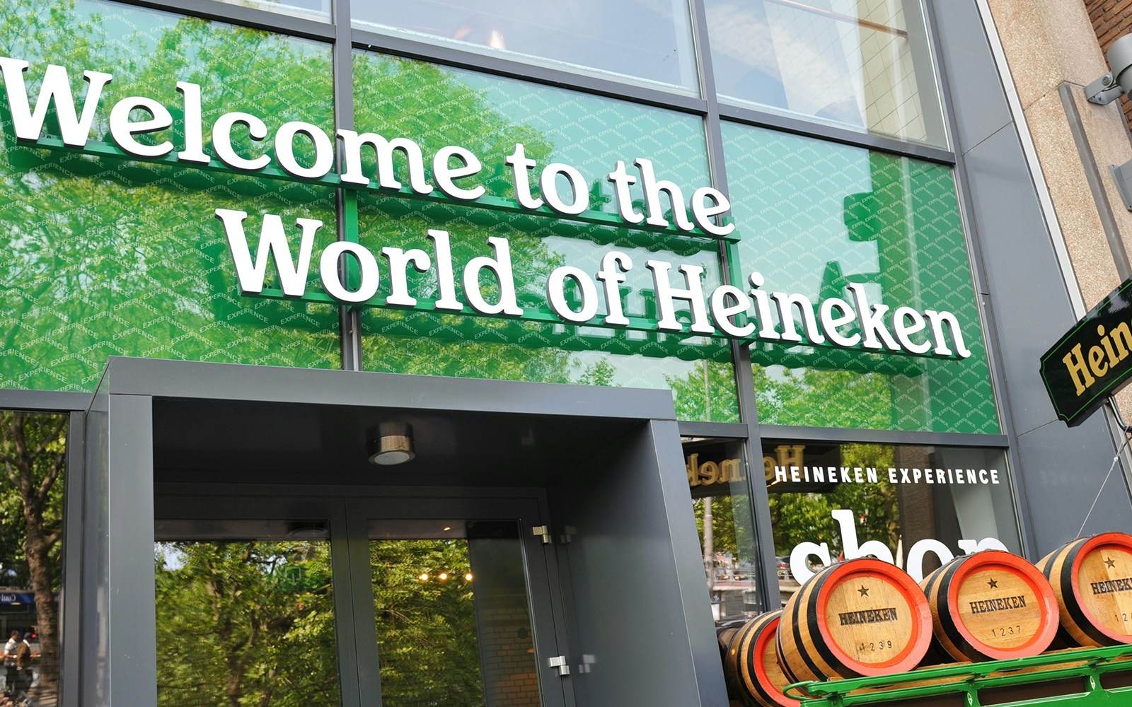 Amsterdam canal cruise with view of Heineken Experience building.