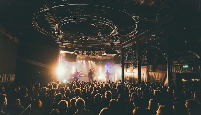 Live performance at Billy Bob's Texas featuring a country music band on stage.