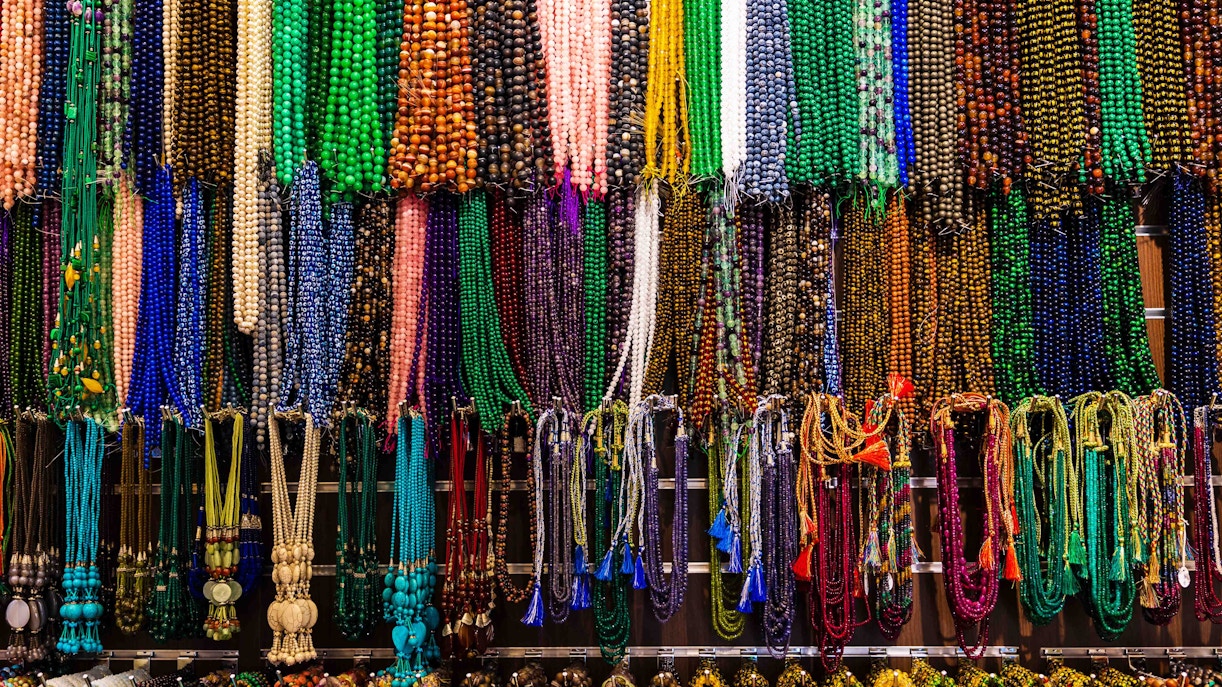 Ripe Market stalls with local vendors and shoppers, Dubai shopping street.