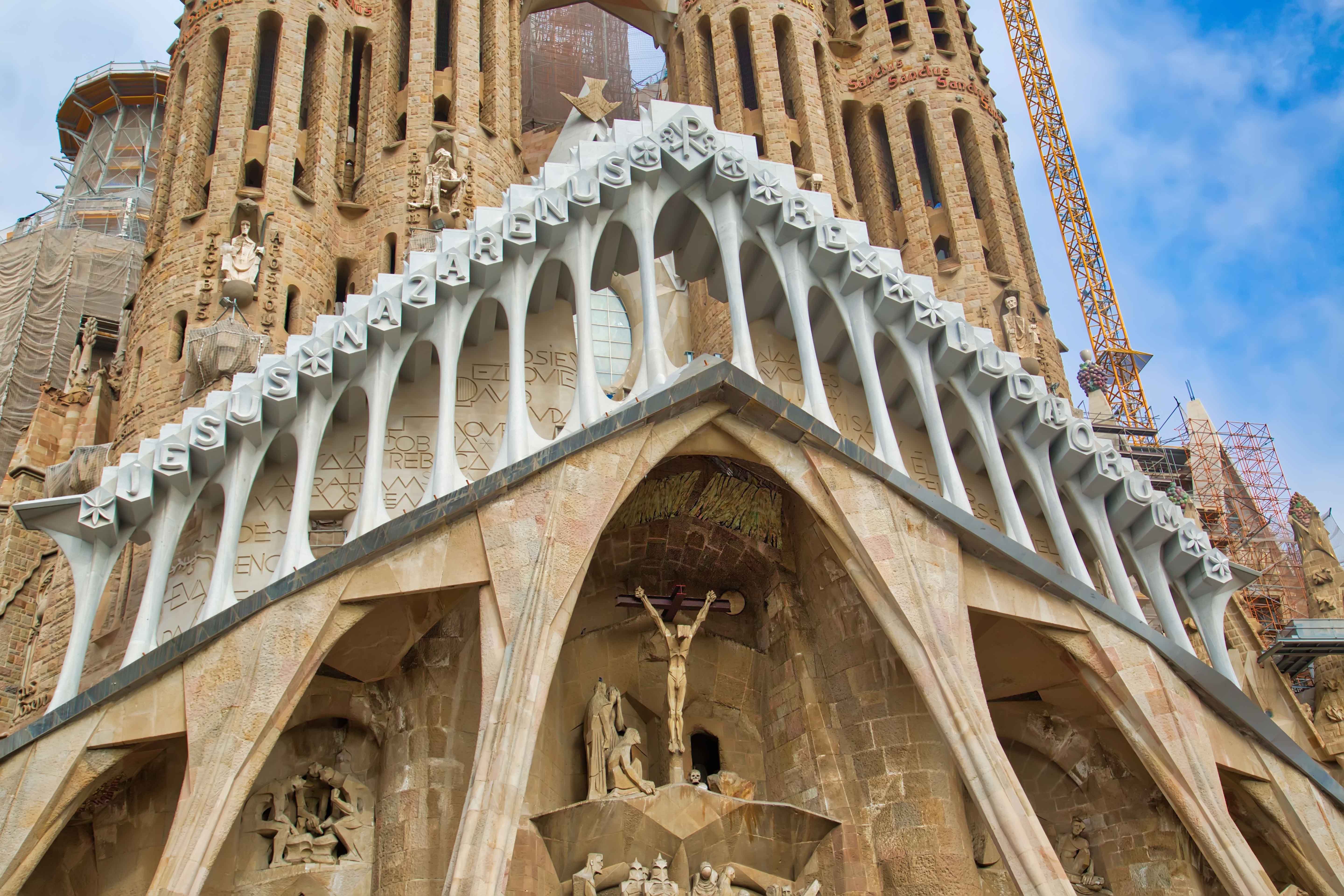 Sagrada Familia crypt interior with intricate stone carvings, Barcelona, Spain.