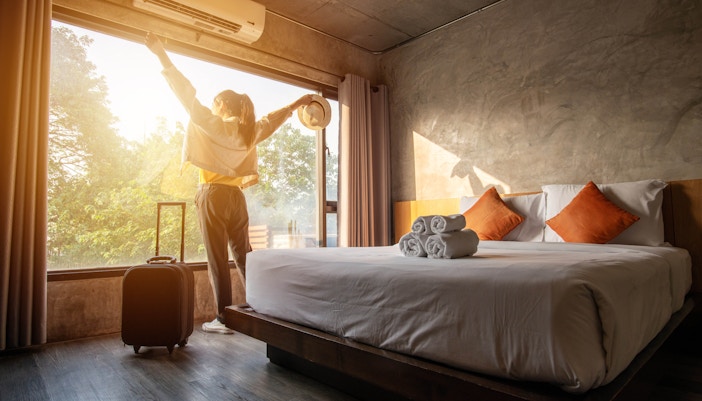 Mid-range hotel with scenic countryside view and traditional architecture.