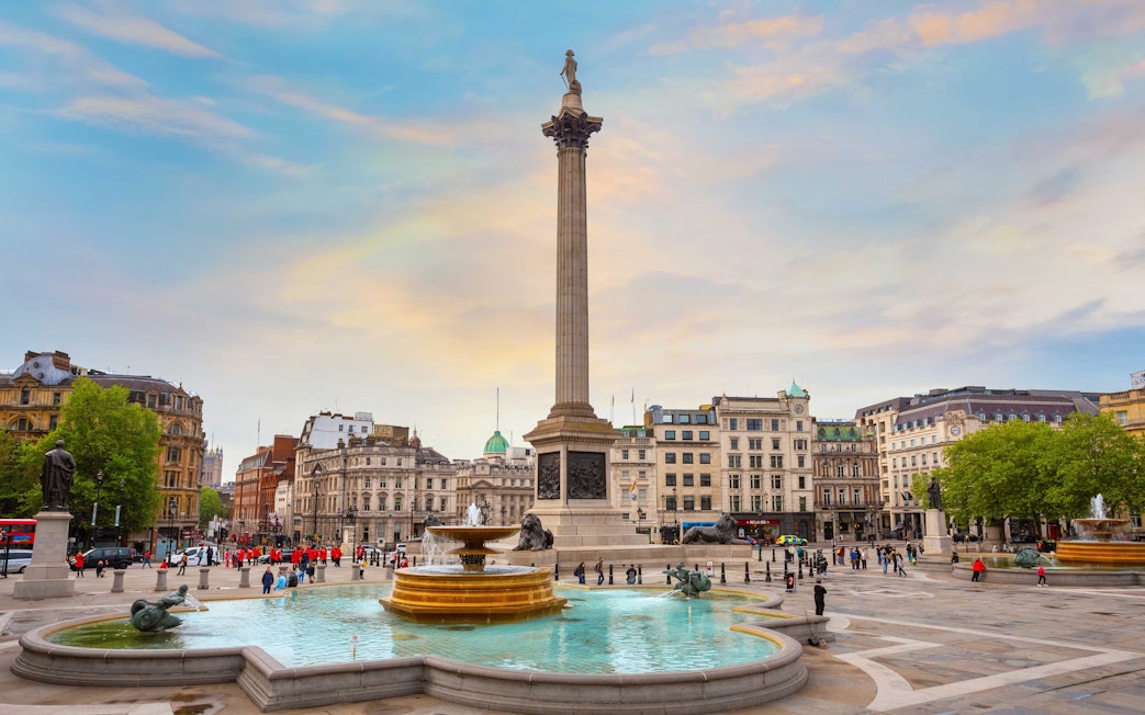 Trafalgar Square in London with Nelson's Column and fountains.
