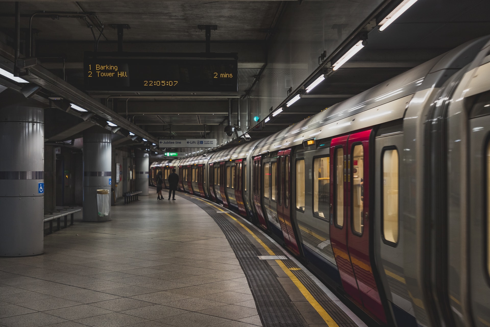 London Underground train at Tower Hill station platform.