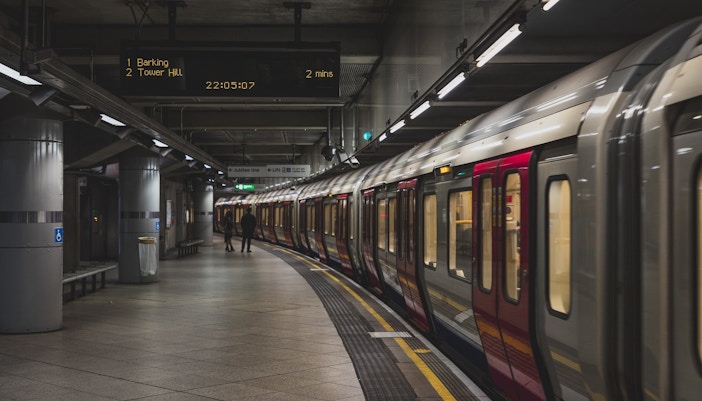 London Underground train at Tower Hill station platform.