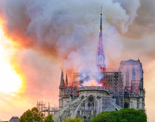 Notre-Dame Cathedral facade with Conciergerie Museum Exhibition 2022 in Paris.
