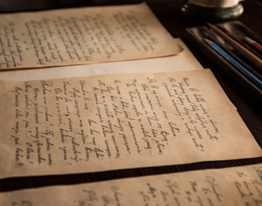 Ancient manuscripts on a desk in the Vatican Archives.