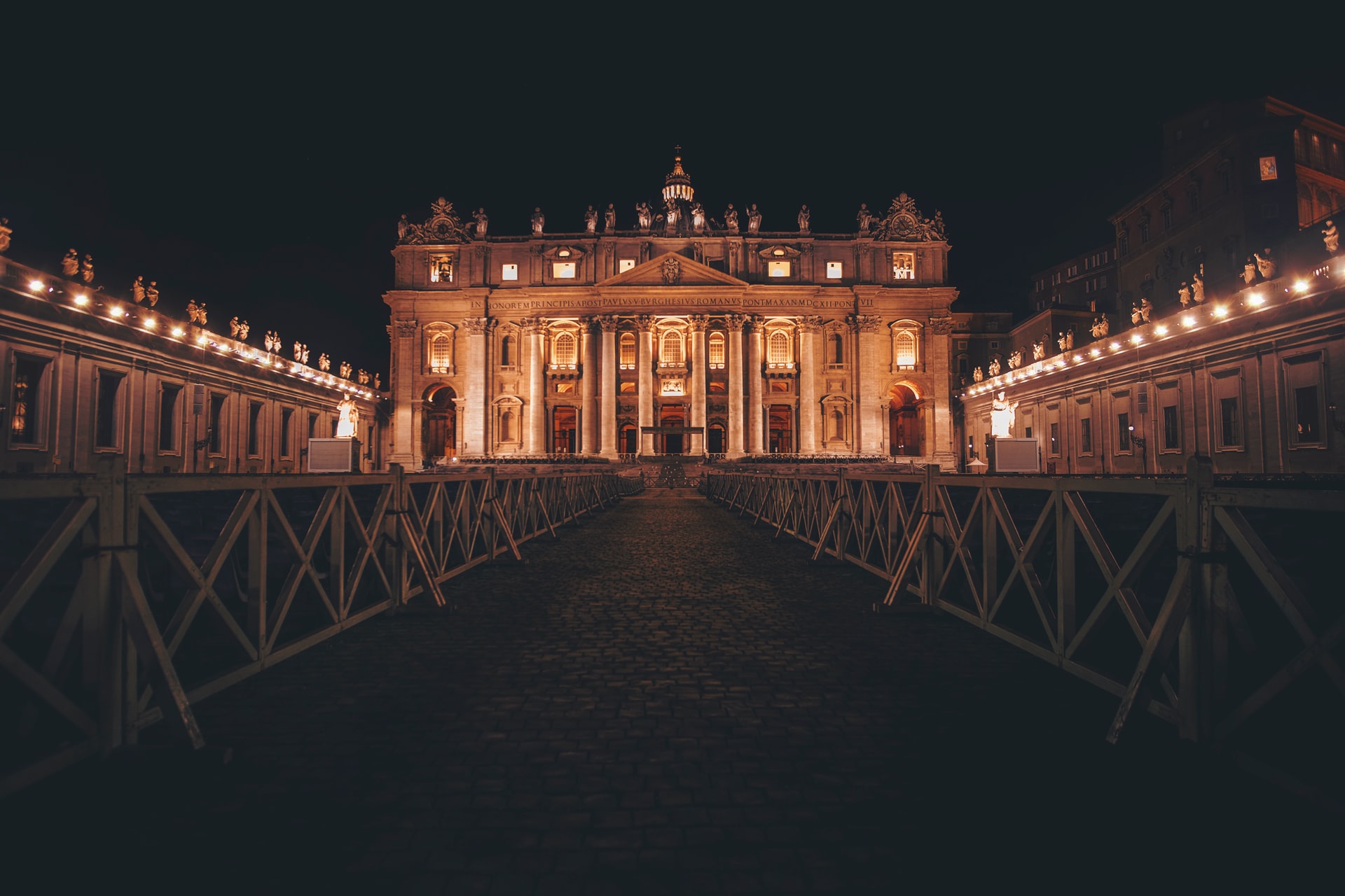 St. Peter's Basilica illuminated at night during Vatican Night Tours.