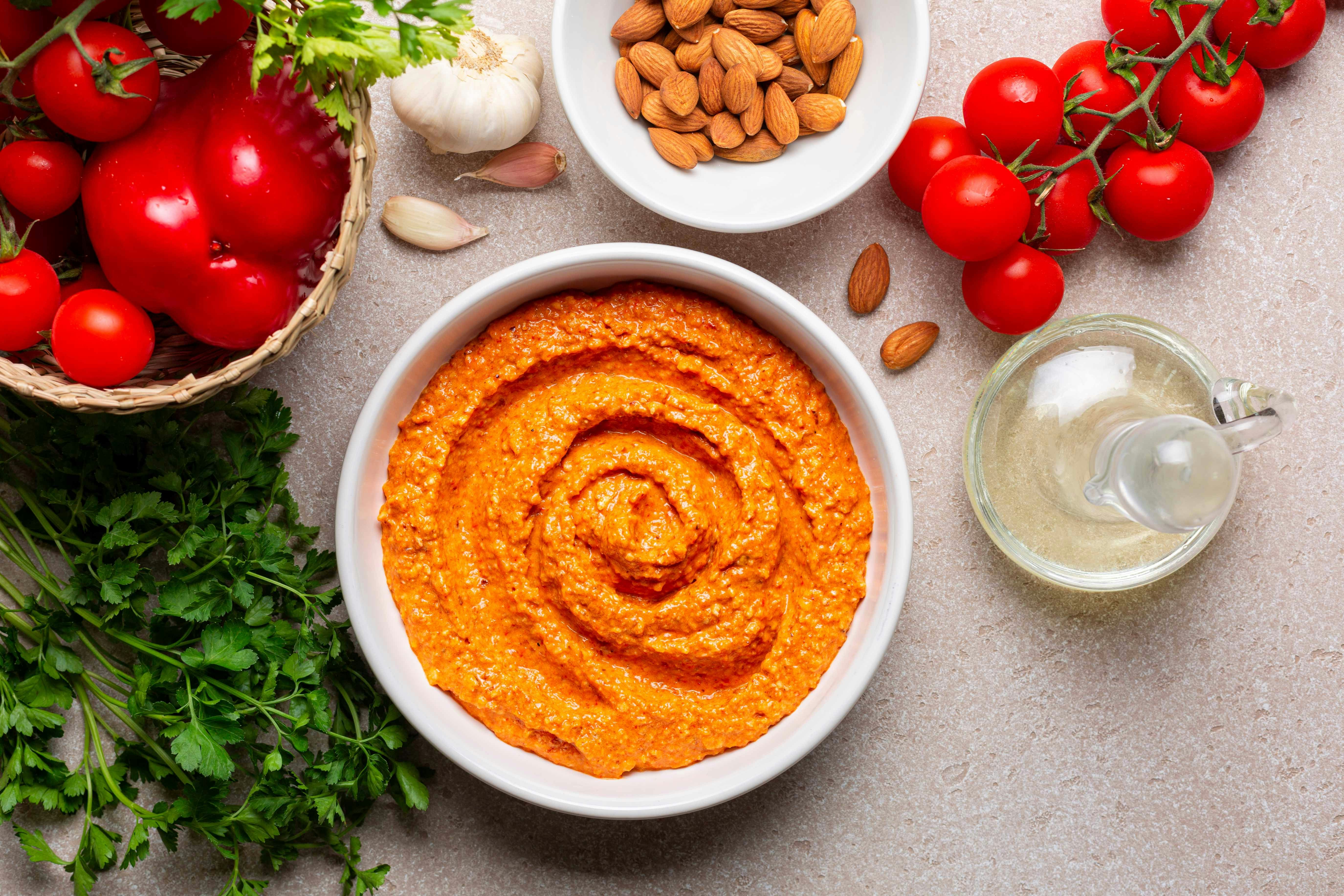 Romesco sauce ingredients with tomatoes, almonds, garlic, and parsley in Barcelona.