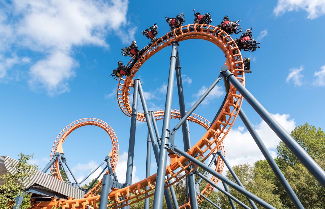 Parque de Atracciones de Madrid water ride with people enjoying the splash in Madrid.