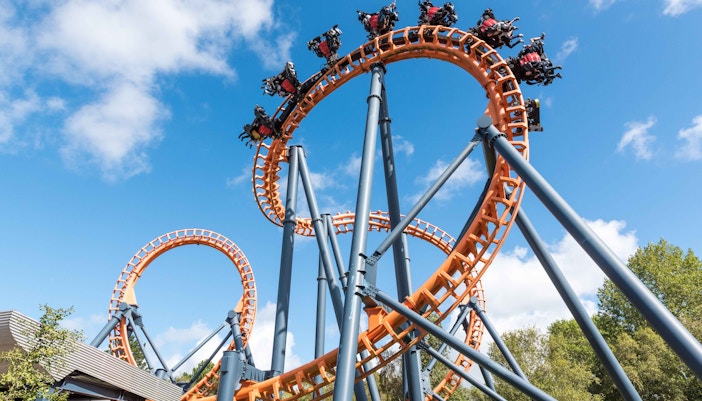 Parque de Atracciones de Madrid water ride with people enjoying the splash in Madrid.