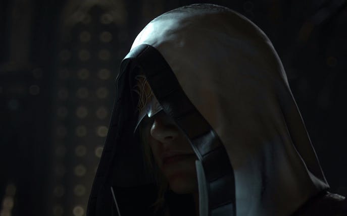 Hooded figure in dimly lit setting, related to "The Longest Con" tour.