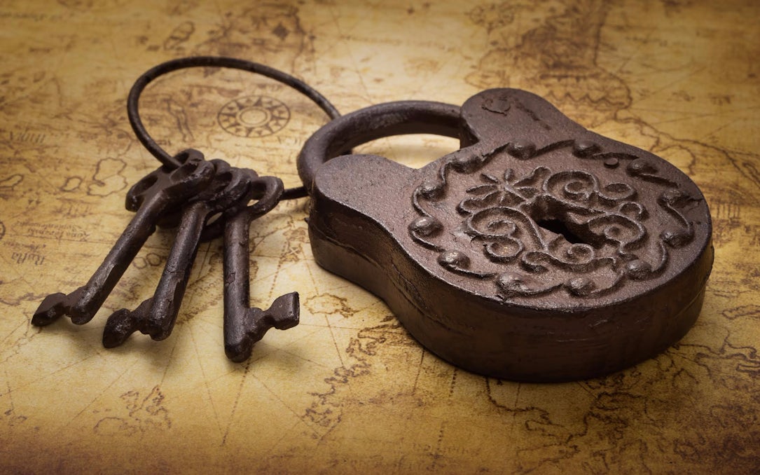 Antique lock and keys on vintage map, related to The Leather Apron tour.