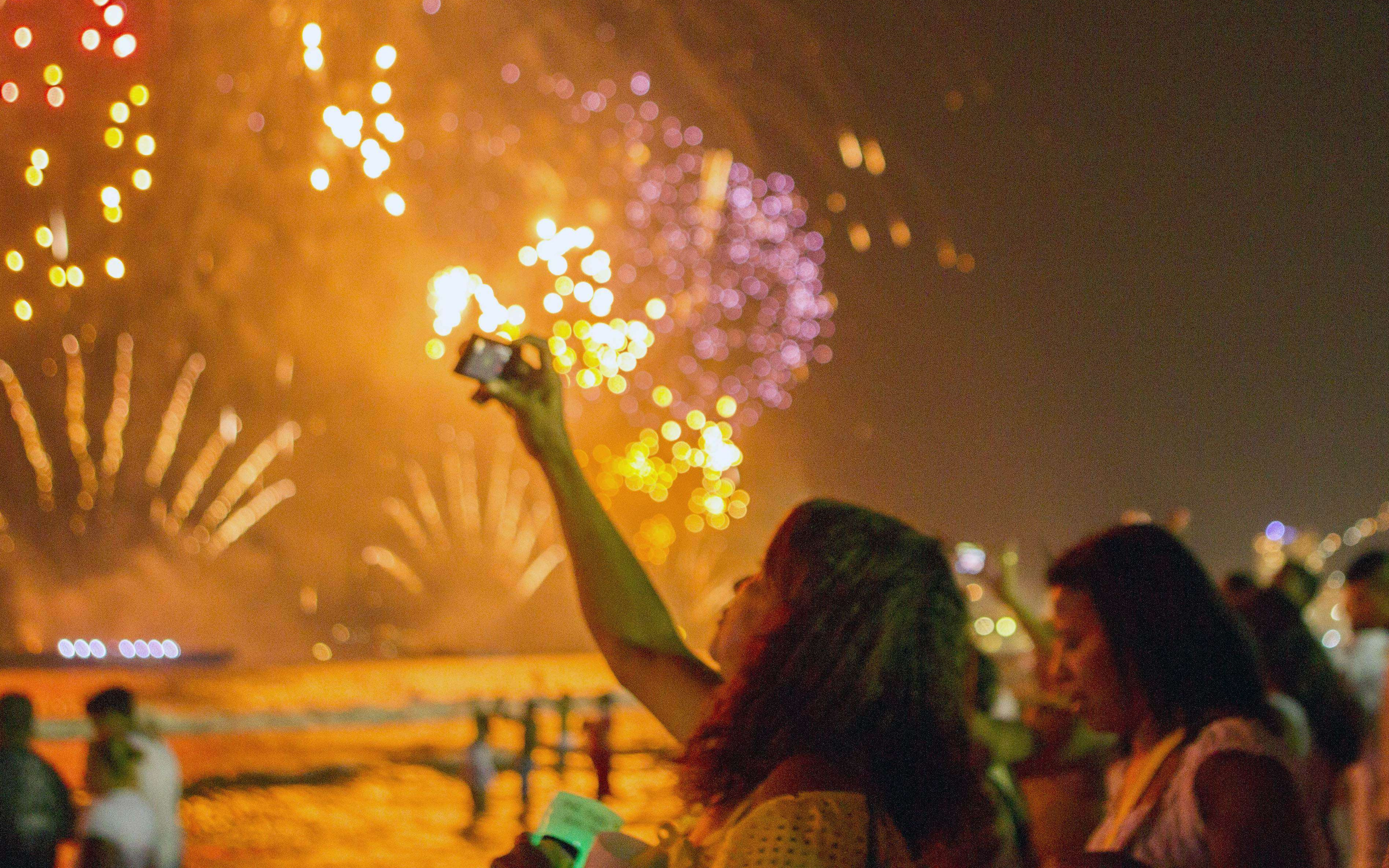 New Year's Eve fireworks viewed from a party cruise boat.