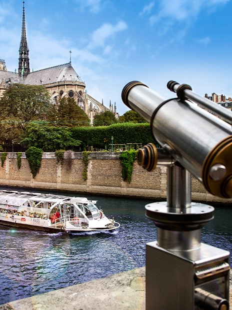 Batobus cruising on the Seine River near Notre-Dame Cathedral in Paris.