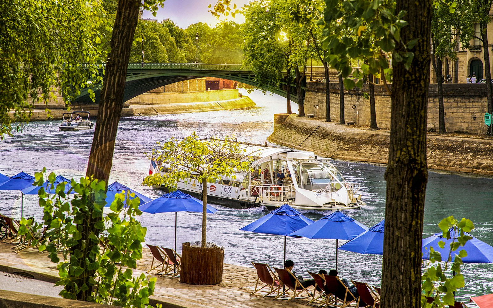 Seine River with Batobus hop-on-hop-off cruise boat in Paris, France.