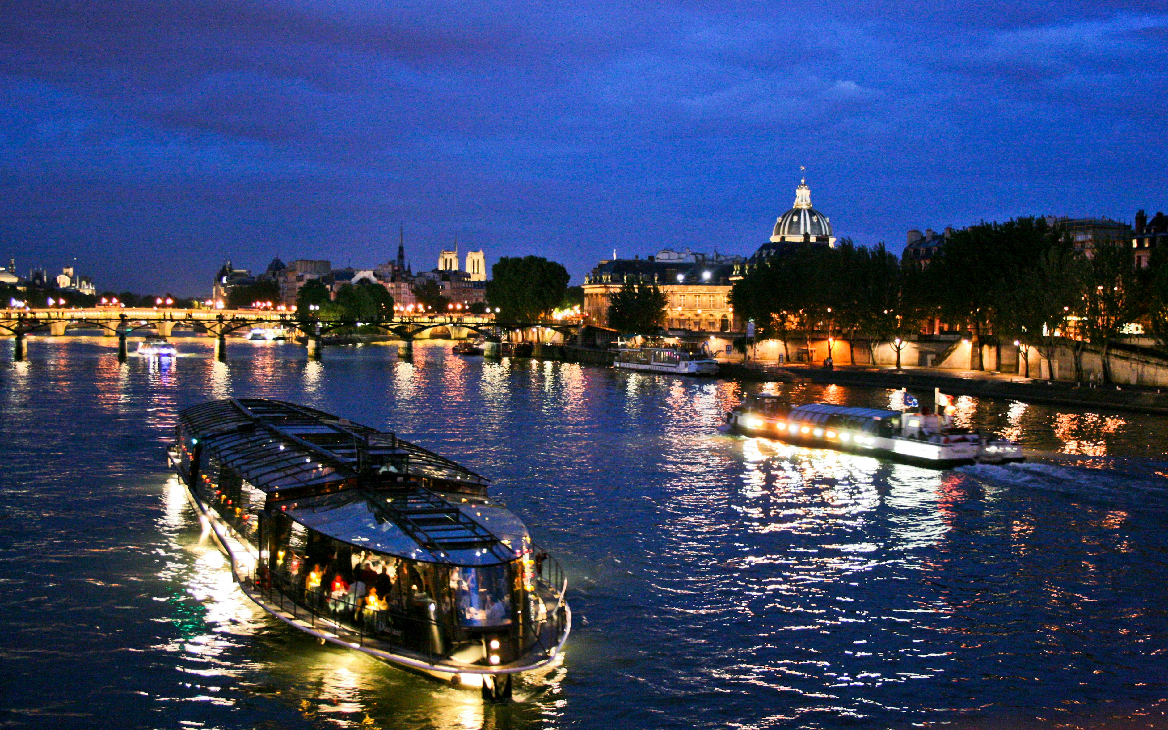 Seine River dinner cruise with illuminated Eiffel Tower in Paris at 8:30pm.