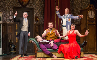 Actors performing a scene from "The Play That Goes Wrong" on stage.