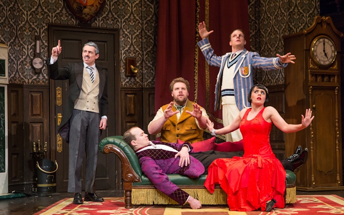 Actors performing a scene from "The Play That Goes Wrong" on stage.