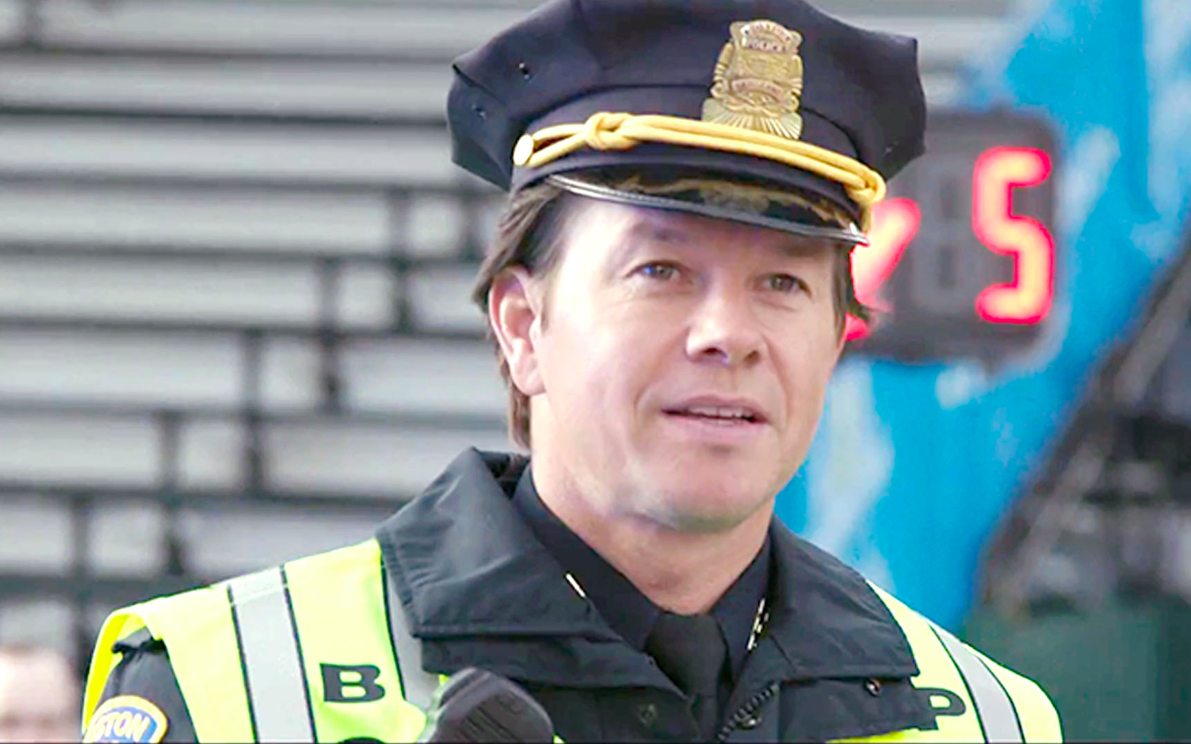 Police officer in uniform at Patriots Day event.
