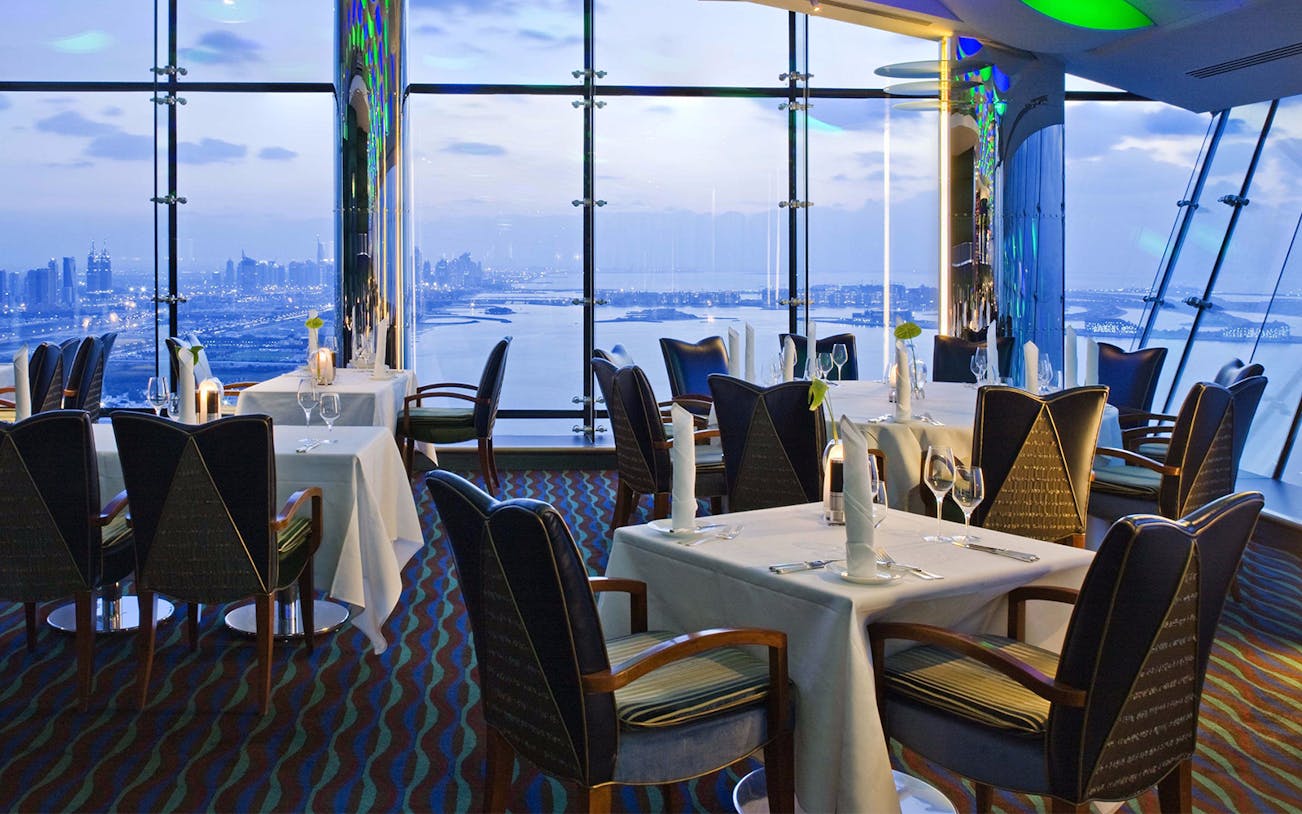 Dining experience at Al Muntaha, Burj Al Arab, Dubai, with panoramic views of the Arabian Gulf.