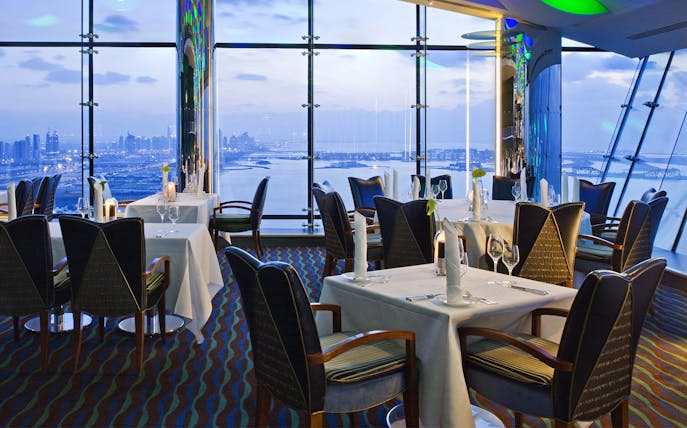 Dining tables with city view at Al Muntaha, Burj Al Arab, Dubai.