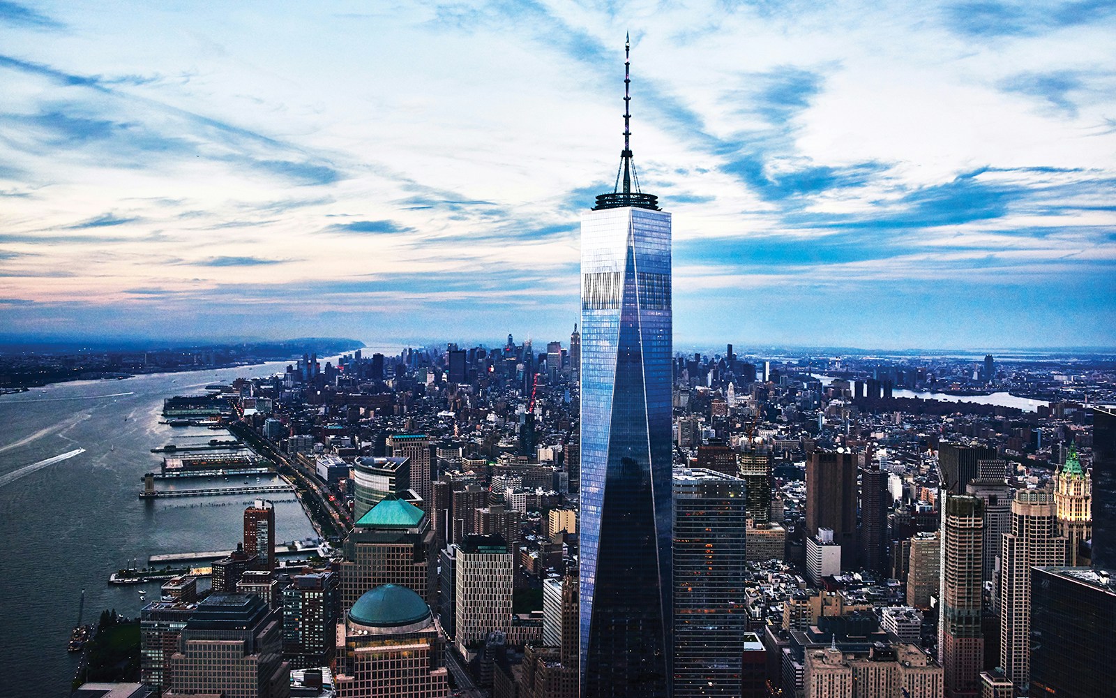 One World Observatory view of New York City skyline at sunset.