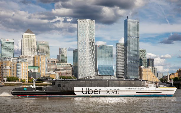 Uber Boat by Thames Clippers on the River Thames with London skyline.