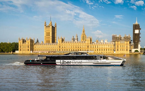Uber Boat on the River Thames with the Houses of Parliament in London.